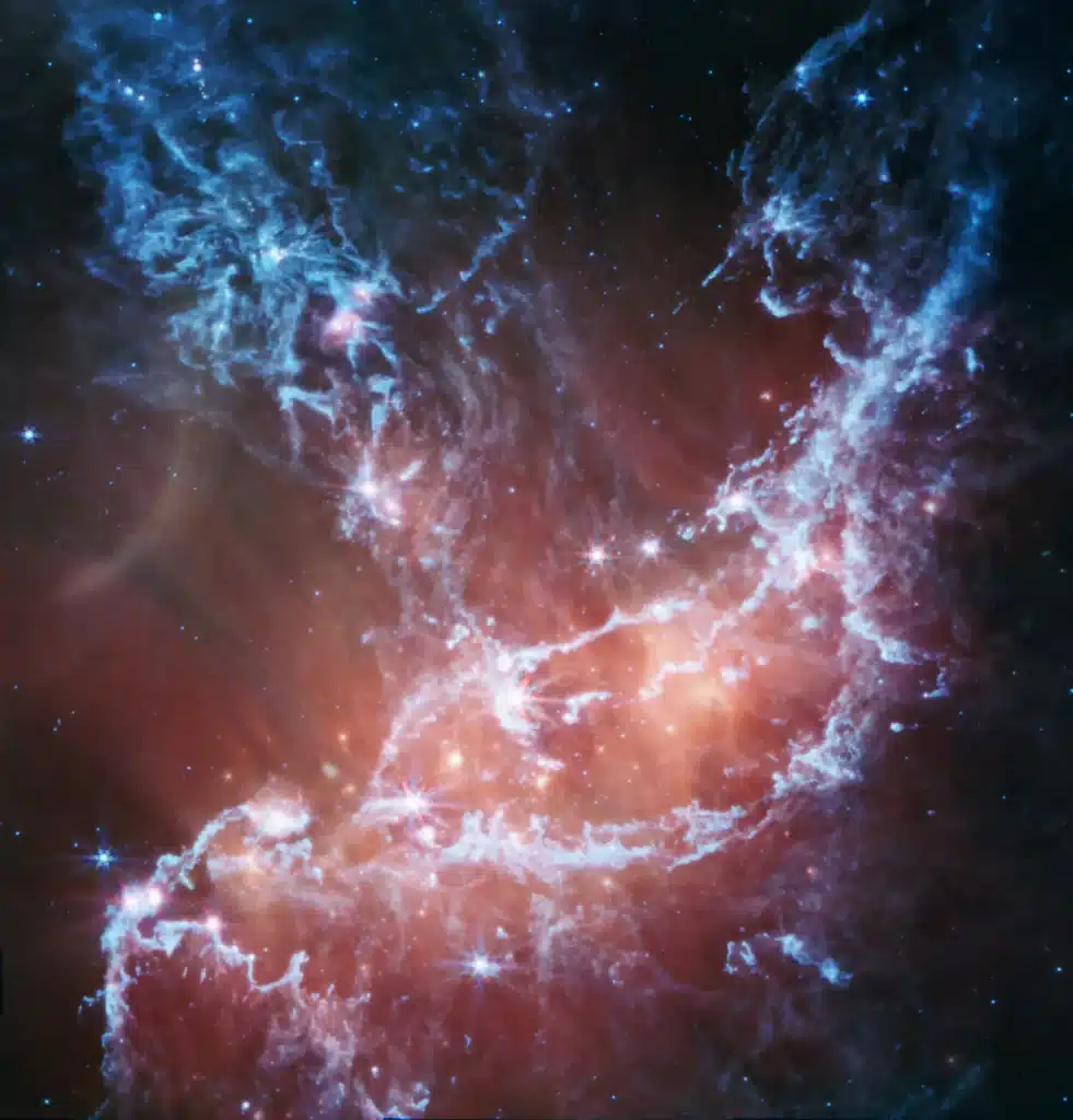 NASAジェイムズ・ウェッブ宇宙望遠鏡が撮影したNGC 346星形成領域。紫色の雲と若い星々が輝く幻想的な風景